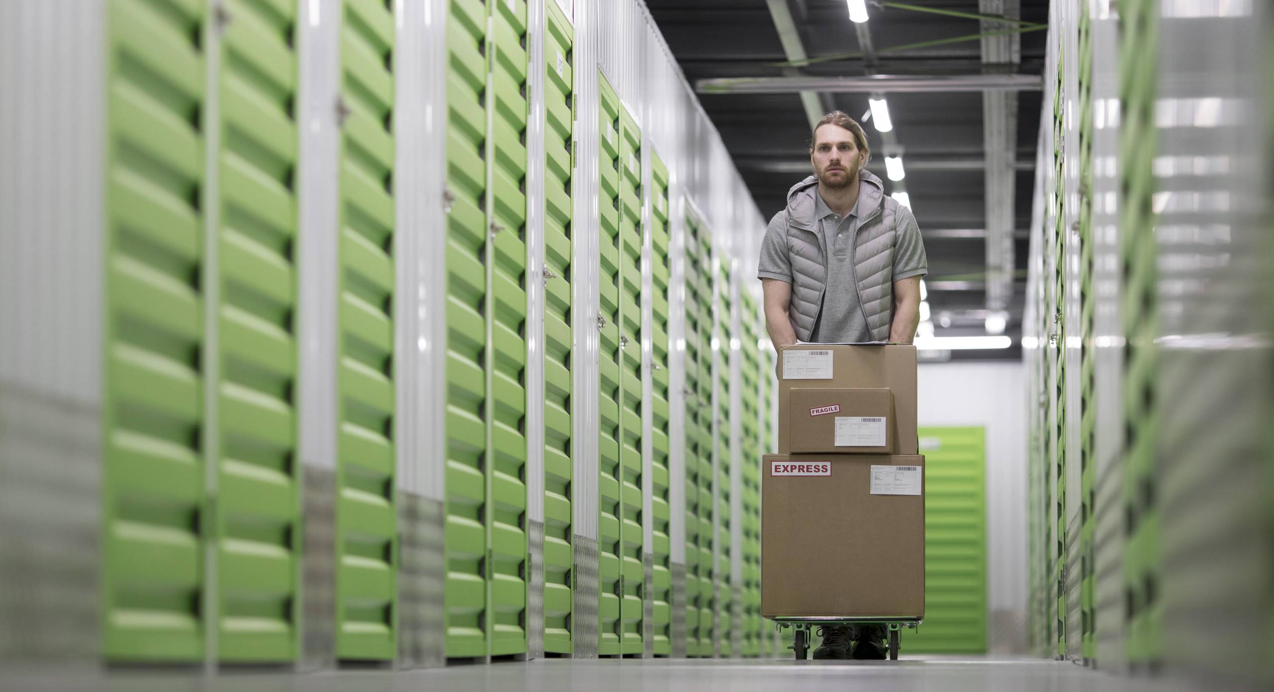 man-working-logistic-center-full-shot